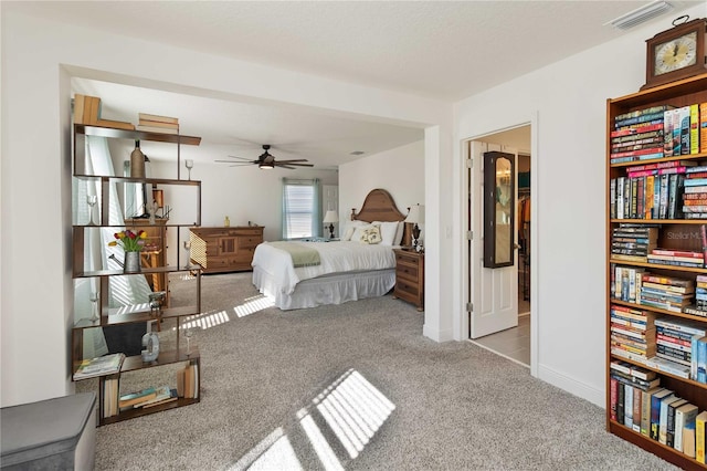 bedroom featuring baseboards, visible vents, and carpet flooring