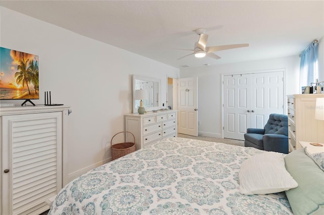 bedroom with a closet, a ceiling fan, and baseboards