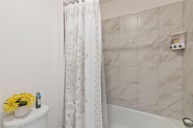 full bathroom featuring shower / bath combo with shower curtain and toilet