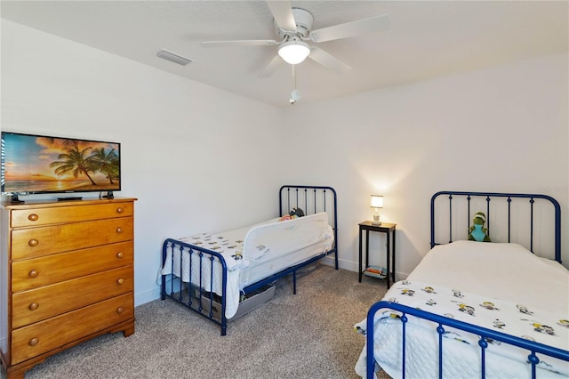 bedroom featuring baseboards, visible vents, ceiling fan, and carpet flooring