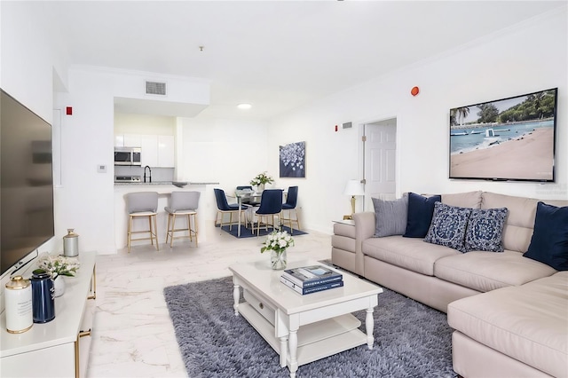 living room featuring crown molding, marble finish floor, visible vents, and recessed lighting