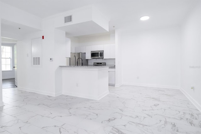 kitchen featuring marble finish floor, appliances with stainless steel finishes, visible vents, and white cabinetry