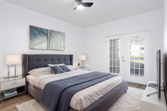 bedroom with access to outside, french doors, ceiling fan, and wood finished floors