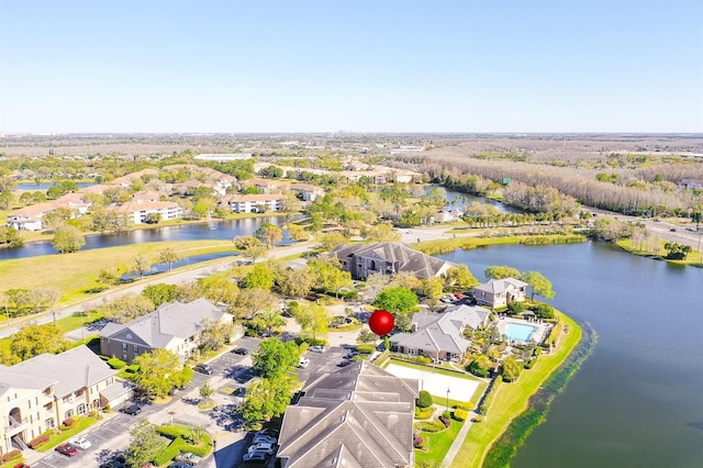 aerial view with a water view and a residential view