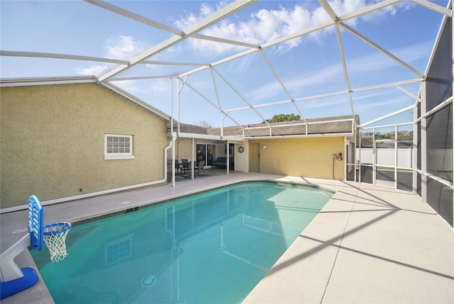 view of swimming pool with a lanai, a patio area, and a fenced in pool