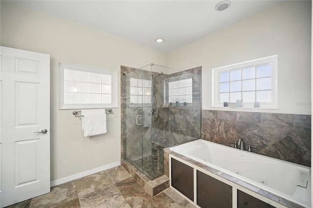 full bath featuring a whirlpool tub, a shower stall, and baseboards