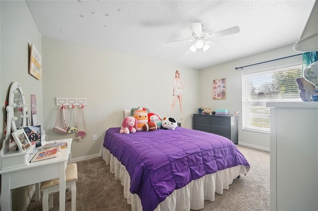 bedroom featuring carpet floors, a textured ceiling, baseboards, and a ceiling fan