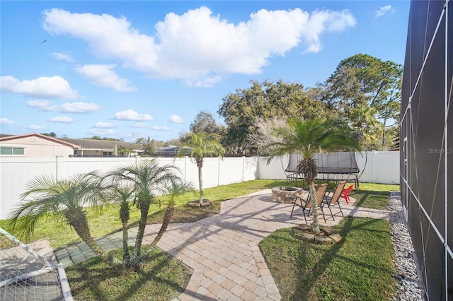 view of patio with a fire pit and a fenced backyard