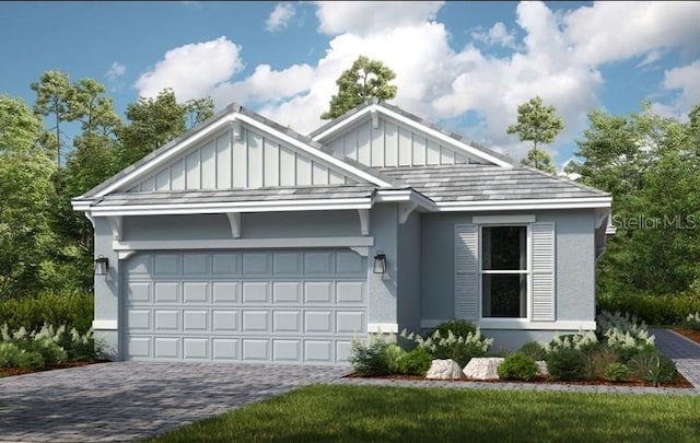 view of front facade featuring board and batten siding, decorative driveway, an attached garage, and stucco siding