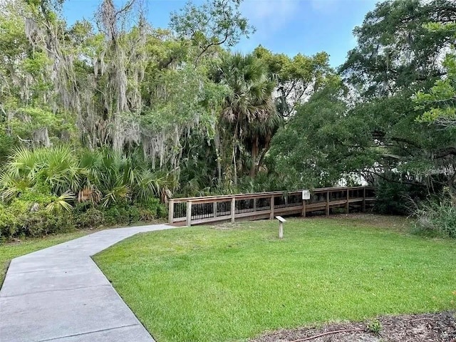 view of property's community featuring a yard