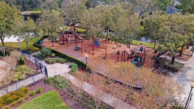 community play area with a water view and fence