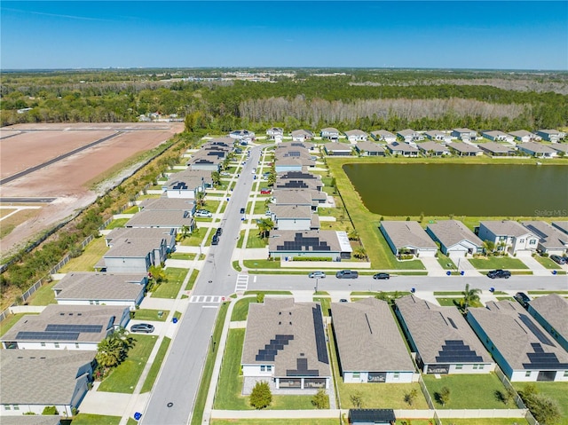 aerial view featuring a residential view and a water view