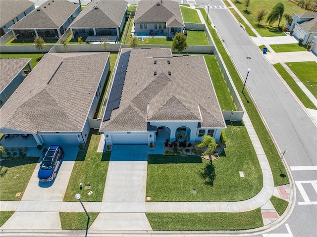 birds eye view of property with a residential view