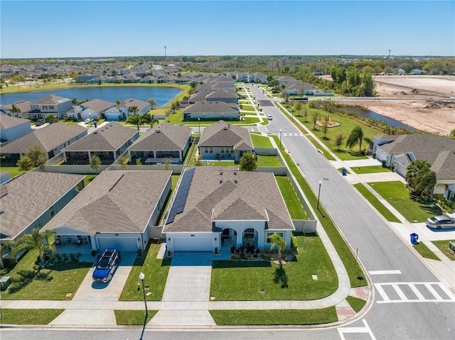 aerial view with a residential view and a water view