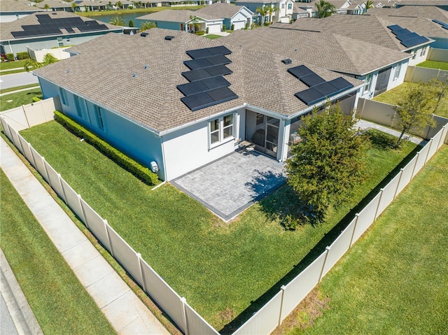 birds eye view of property with a residential view