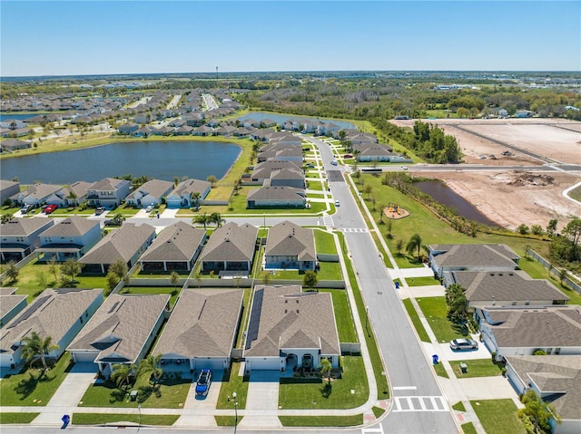 aerial view with a water view and a residential view