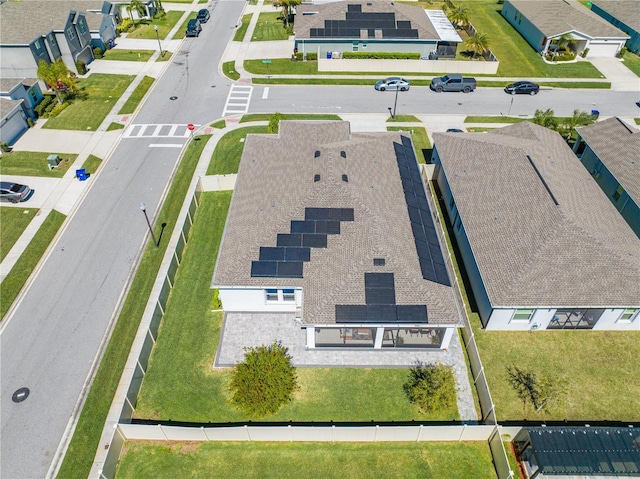 birds eye view of property with a residential view