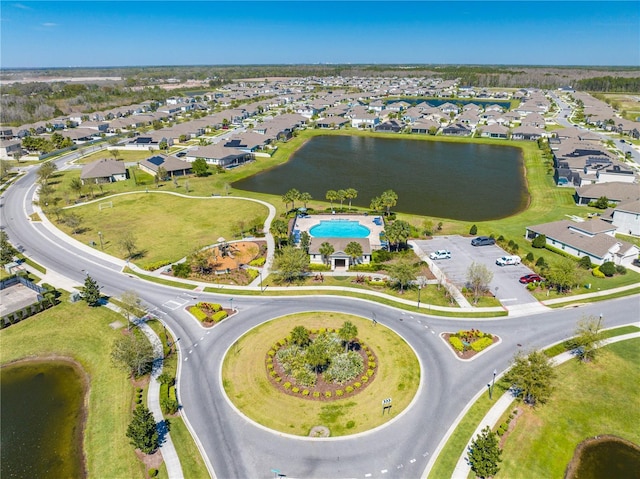 birds eye view of property featuring a water view and a residential view