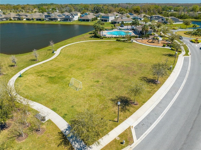 drone / aerial view with a water view and a residential view