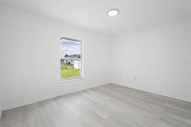 4717 Shad Dr, Sebring, FL 33870 - empty room featuring baseboards and light wood finished floors