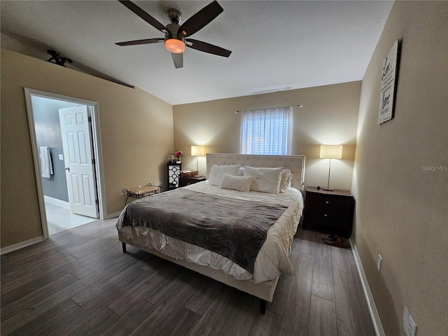 bedroom with ensuite bath, wood-type flooring, baseboards, and a ceiling fan