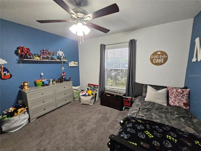 bedroom featuring carpet, ceiling fan, and a textured ceiling