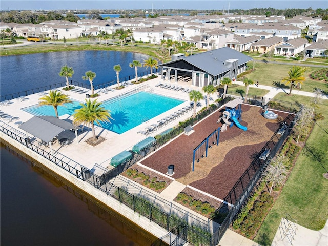 aerial view with a water view and a residential view