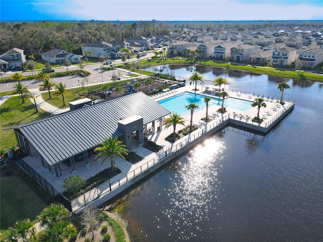 aerial view with a water view and a residential view