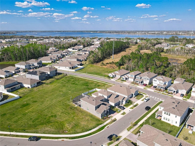 aerial view with a water view and a residential view