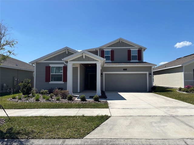 view of front of property with a garage, board and batten siding, and concrete driveway