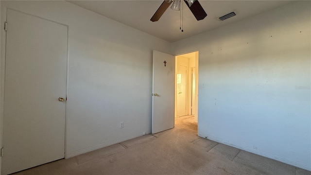 unfurnished bedroom with ceiling fan, visible vents, and baseboards