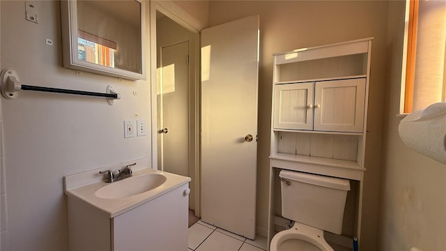 bathroom featuring vanity, toilet, and tile patterned floors