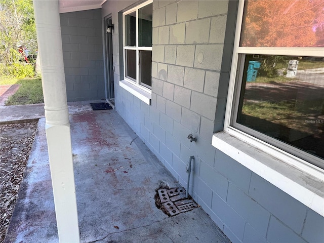 view of property exterior featuring concrete block siding