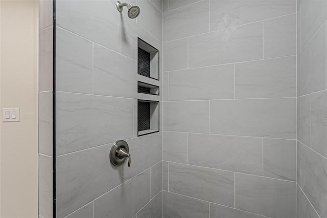 details featuring a tile shower