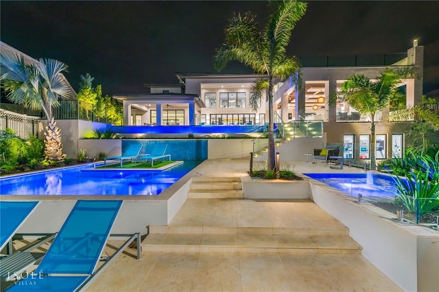 pool at twilight featuring a fenced in pool, a patio, and fence