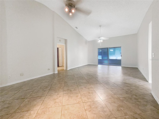 empty room with light tile patterned floors, visible vents, high vaulted ceiling, and a ceiling fan