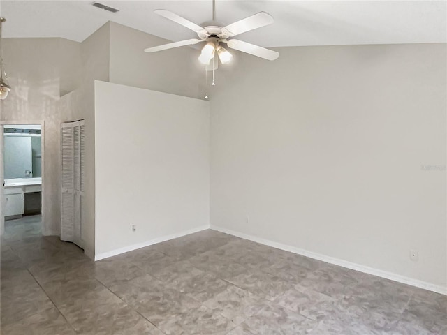 spare room featuring ceiling fan, high vaulted ceiling, visible vents, and baseboards
