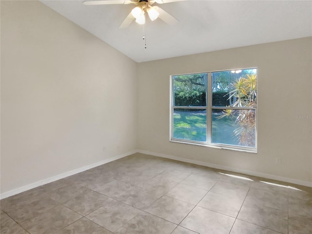 unfurnished room with light tile patterned floors, ceiling fan, and baseboards