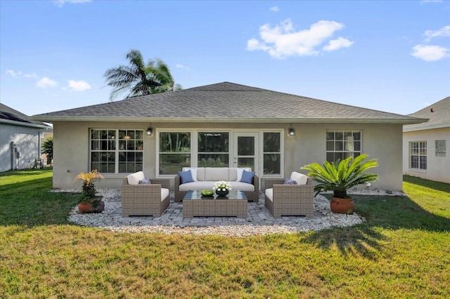 back of house featuring a shingled roof, stucco siding, a patio area, a lawn, and an outdoor hangout area