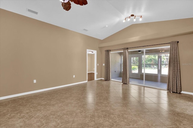 spare room with visible vents, baseboards, a ceiling fan, and vaulted ceiling