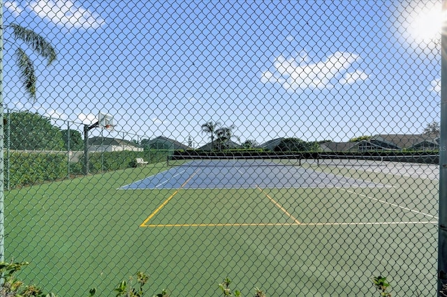 view of sport court with fence