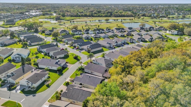 drone / aerial view featuring a residential view and a water view