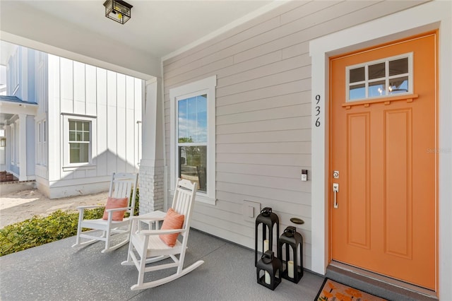 view of exterior entry with covered porch