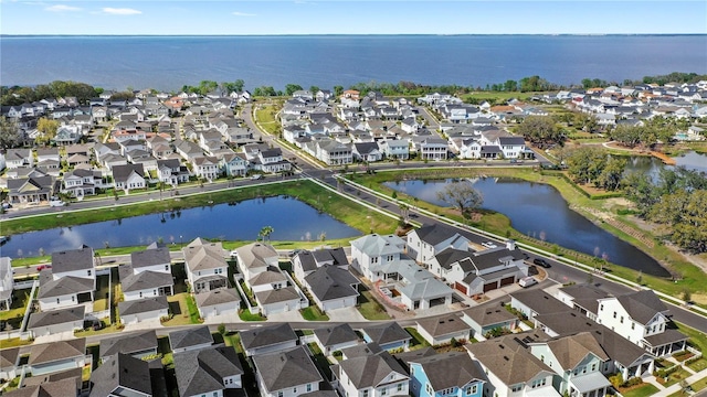 bird's eye view with a water view and a residential view