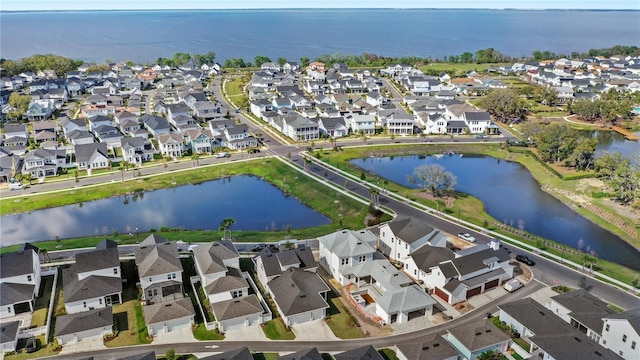 aerial view featuring a residential view and a water view