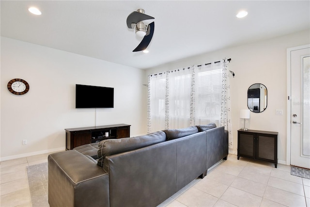 living room featuring light tile patterned floors, baseboards, a ceiling fan, and recessed lighting