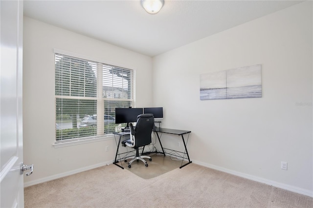 carpeted office with baseboards