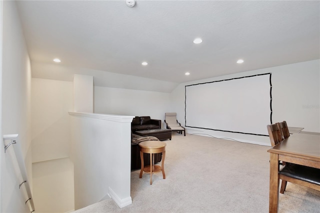 home theater with recessed lighting, light colored carpet, and lofted ceiling