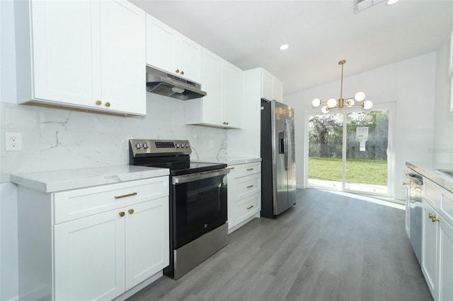 kitchen with stainless steel appliances, tasteful backsplash, white cabinetry, and under cabinet range hood