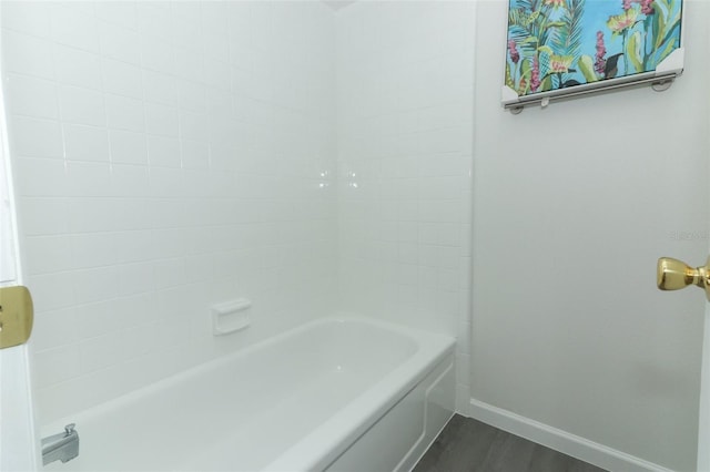 bathroom featuring baseboards and wood finished floors